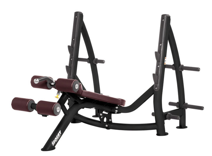 Hoist commercial Olympic decline burgundy bench with barbell rack and integrated weight plate storage for lower chest training