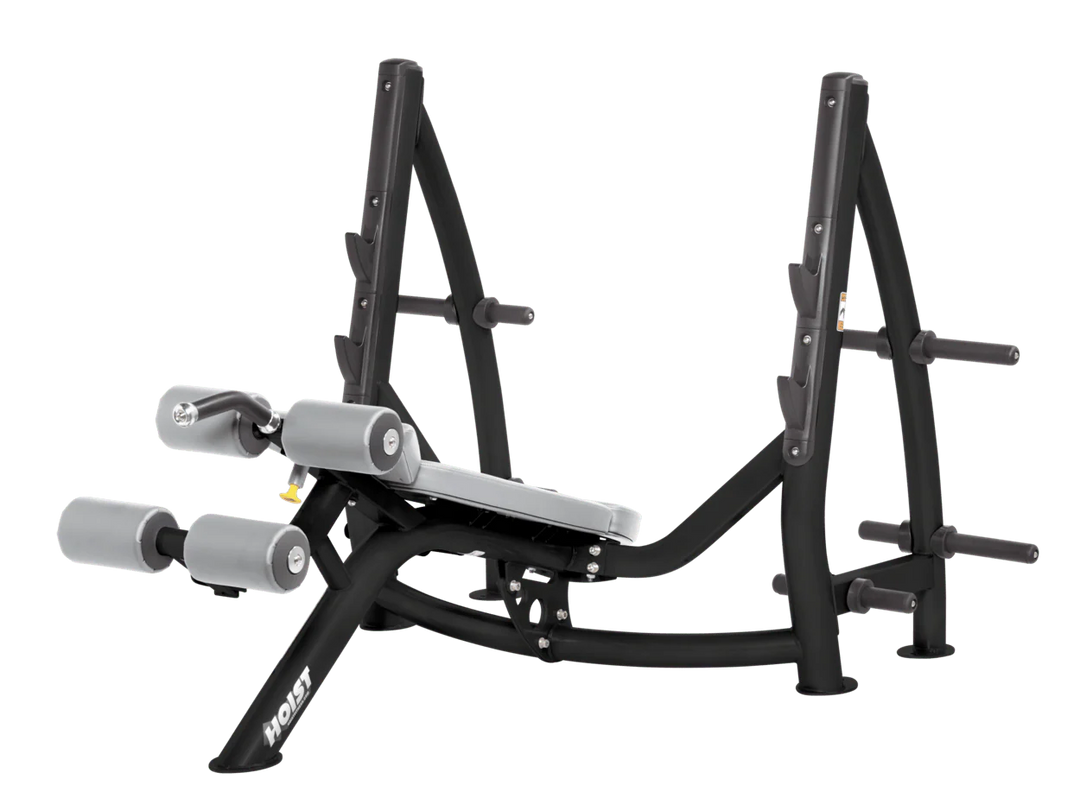 Hoist commercial Olympic decline dove grey bench with barbell rack and integrated weight plate storage for lower chest training