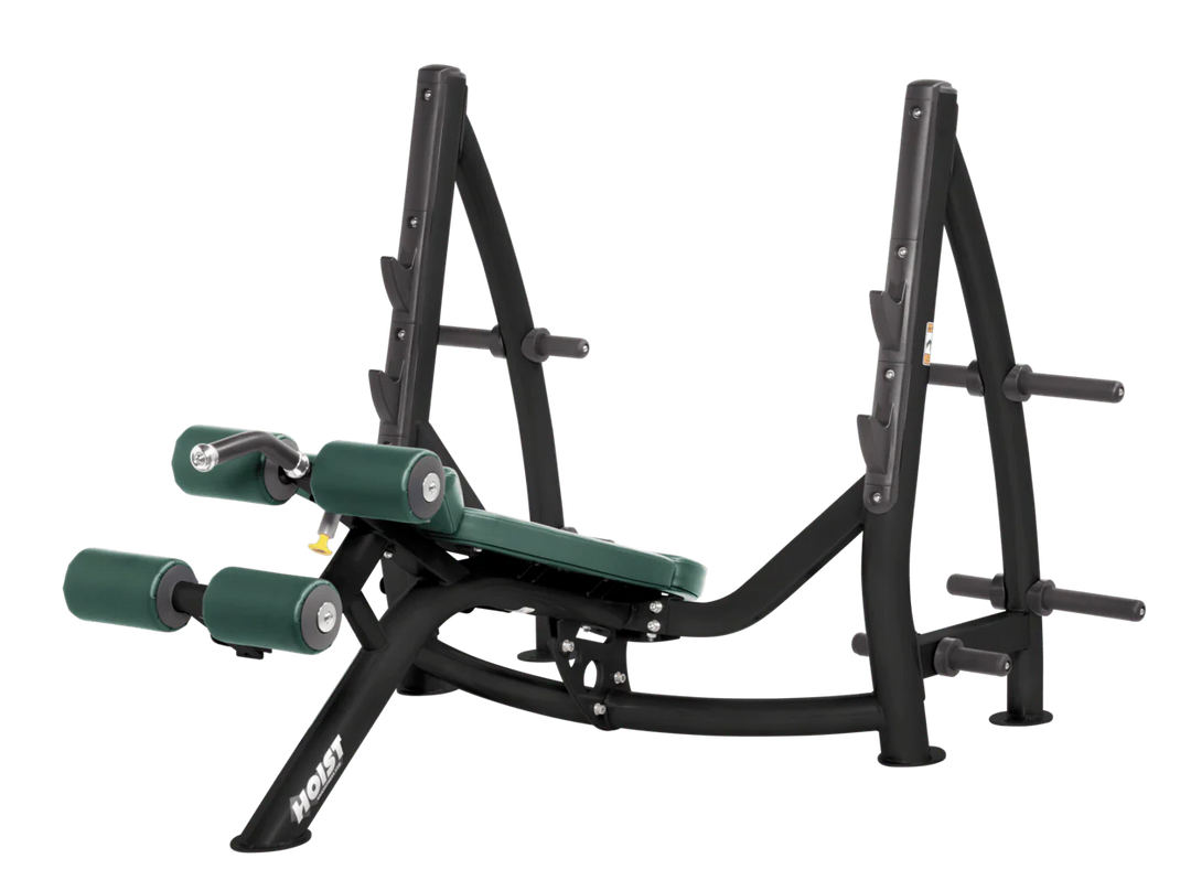 Hoist commercial Olympic decline hunter green bench with barbell rack and integrated weight plate storage for lower chest training