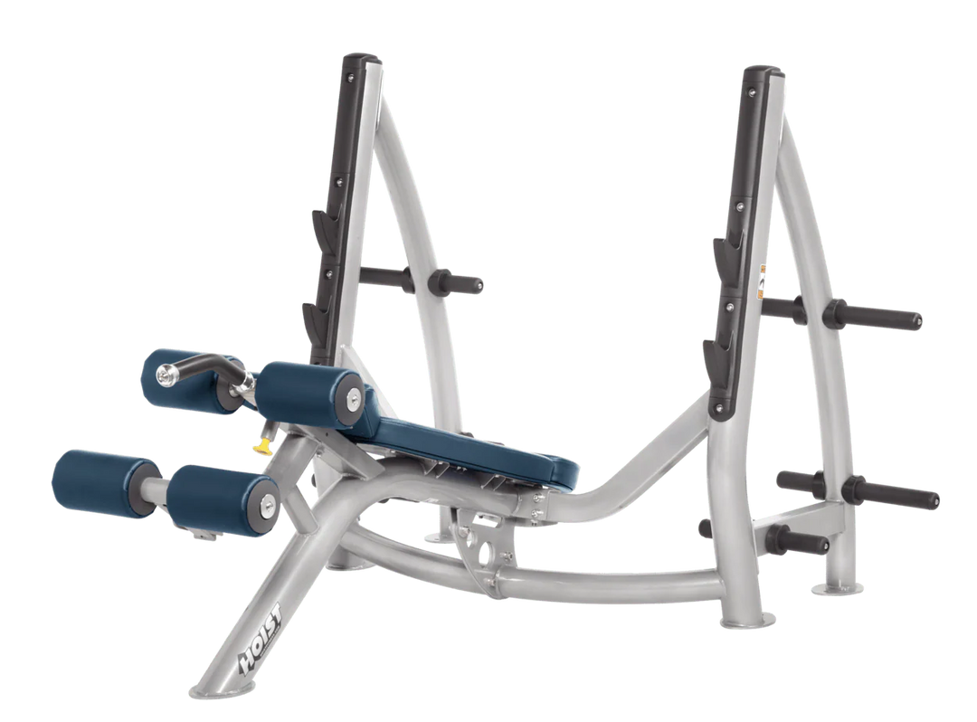 Hoist commercial Olympic decline platinum navy blue bench with barbell rack and integrated weight plate storage for lower chest training
