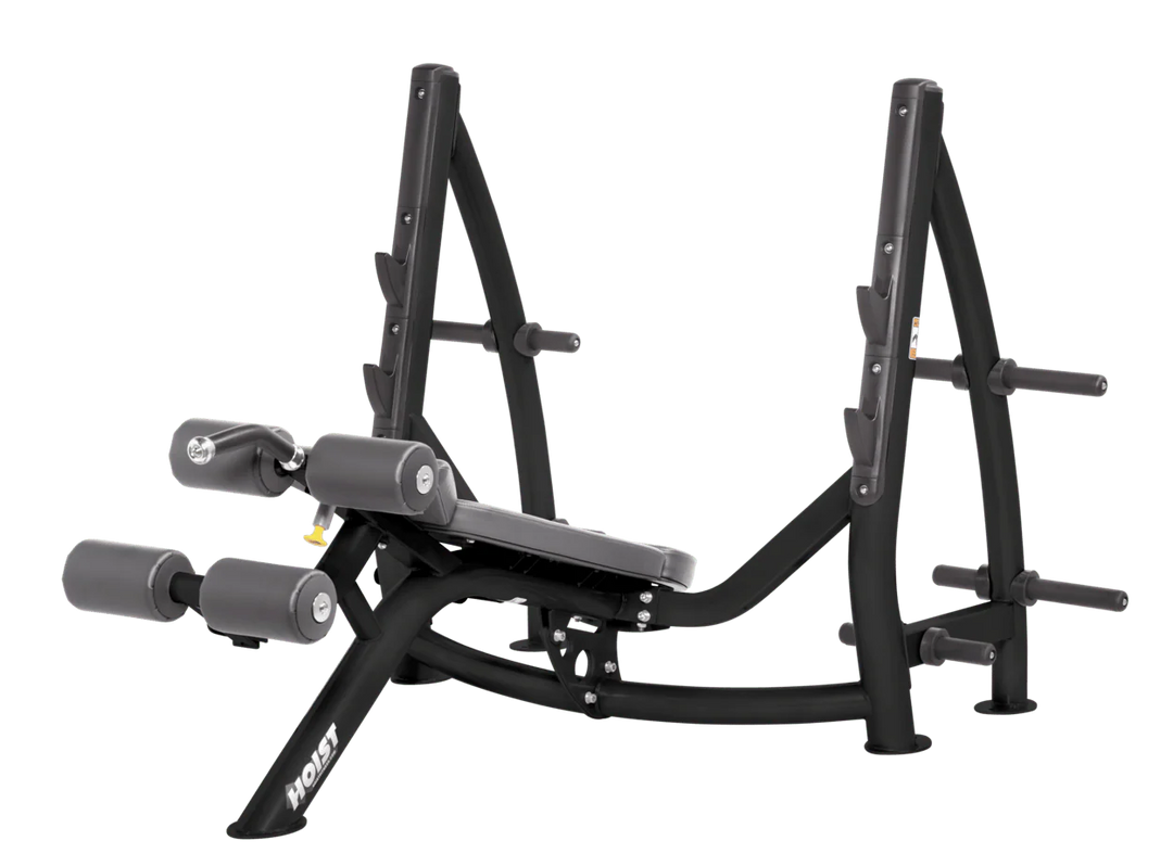 Hoist commercial Olympic decline slate grey bench with barbell rack and integrated weight plate storage for lower chest training