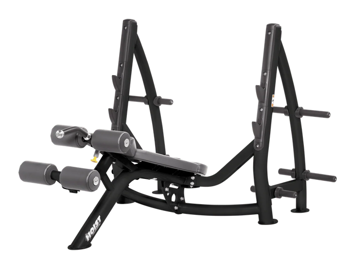 Hoist commercial Olympic decline slate grey bench with barbell rack and integrated weight plate storage for lower chest training