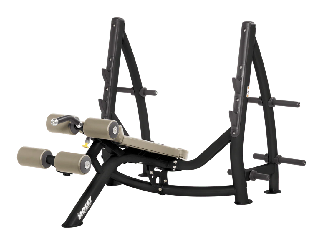Hoist commercial Olympic decline suede bench with barbell rack and integrated weight plate storage for lower chest training