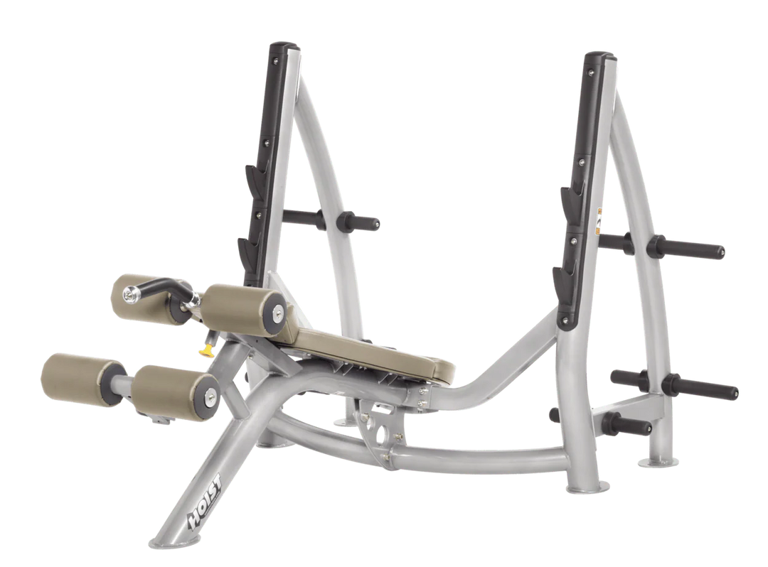 Hoist commercial Olympic decline platinum suede bench with barbell rack and integrated weight plate storage for lower chest training
