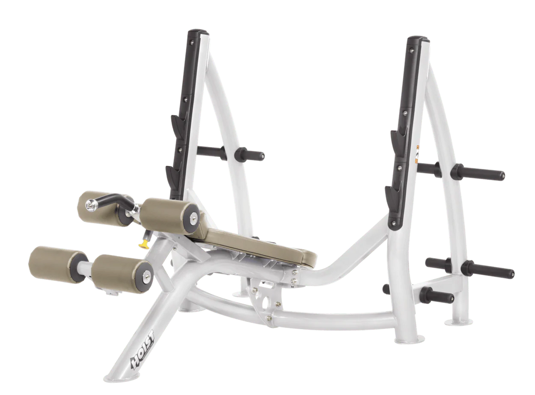 Hoist commercial Olympic decline white suede bench with barbell rack and integrated weight plate storage for lower chest training