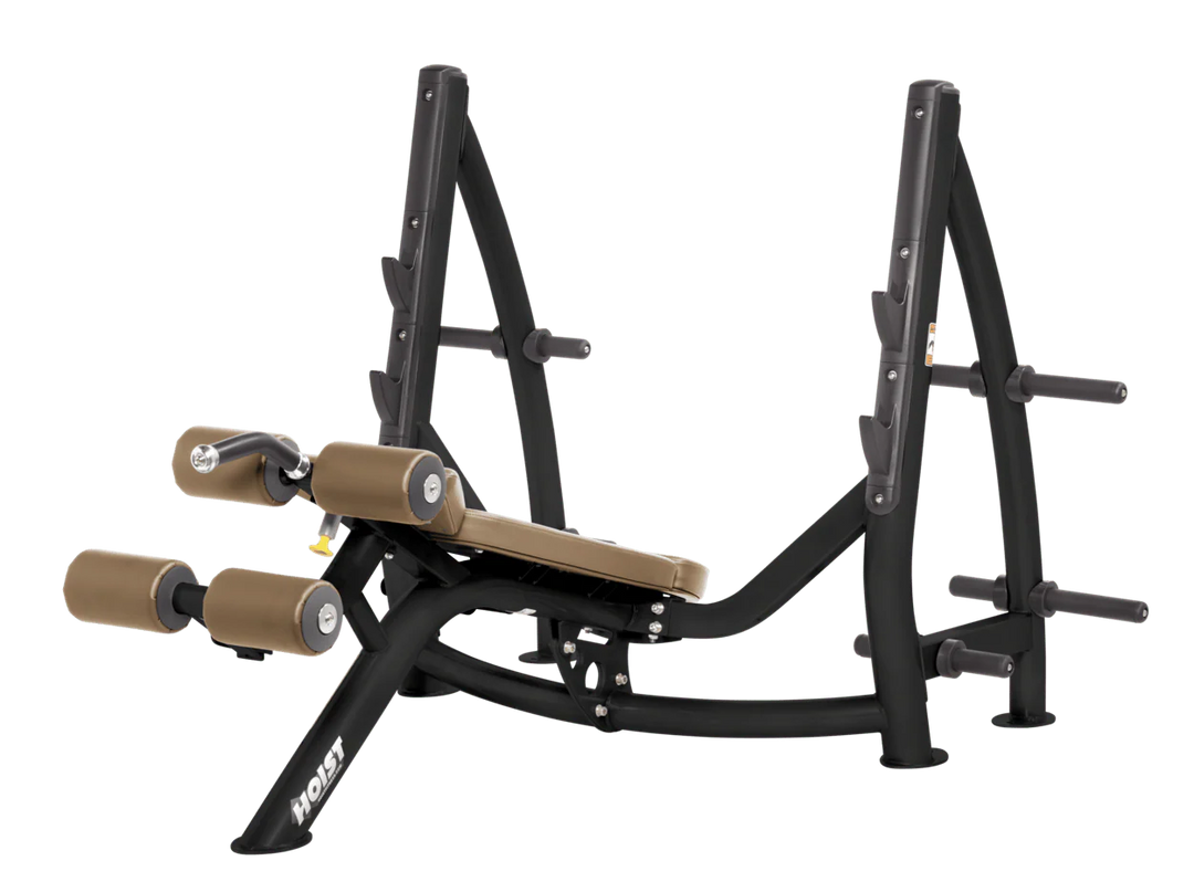 Hoist commercial Olympic decline wheat bench with barbell rack and integrated weight plate storage for lower chest training