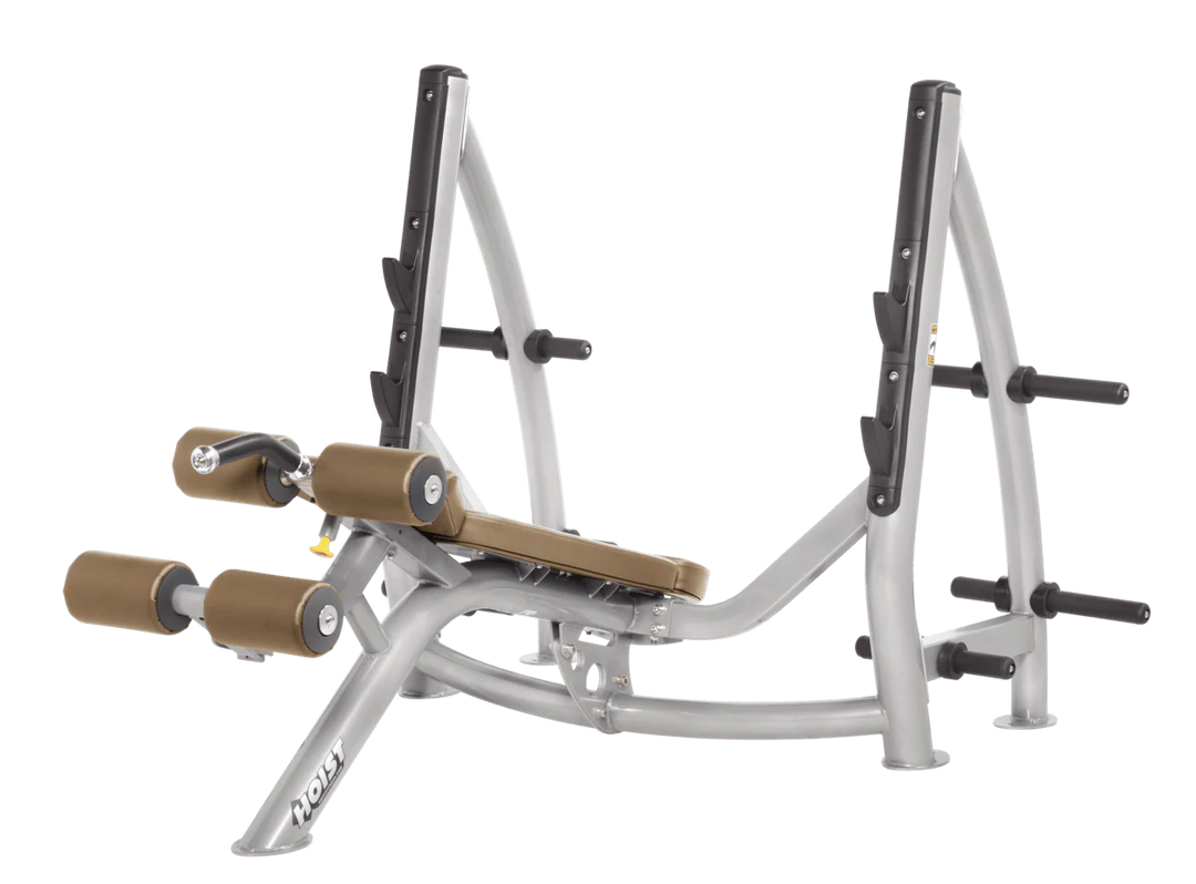 Hoist commercial Olympic decline platinum wheat bench with barbell rack and integrated weight plate storage for lower chest training