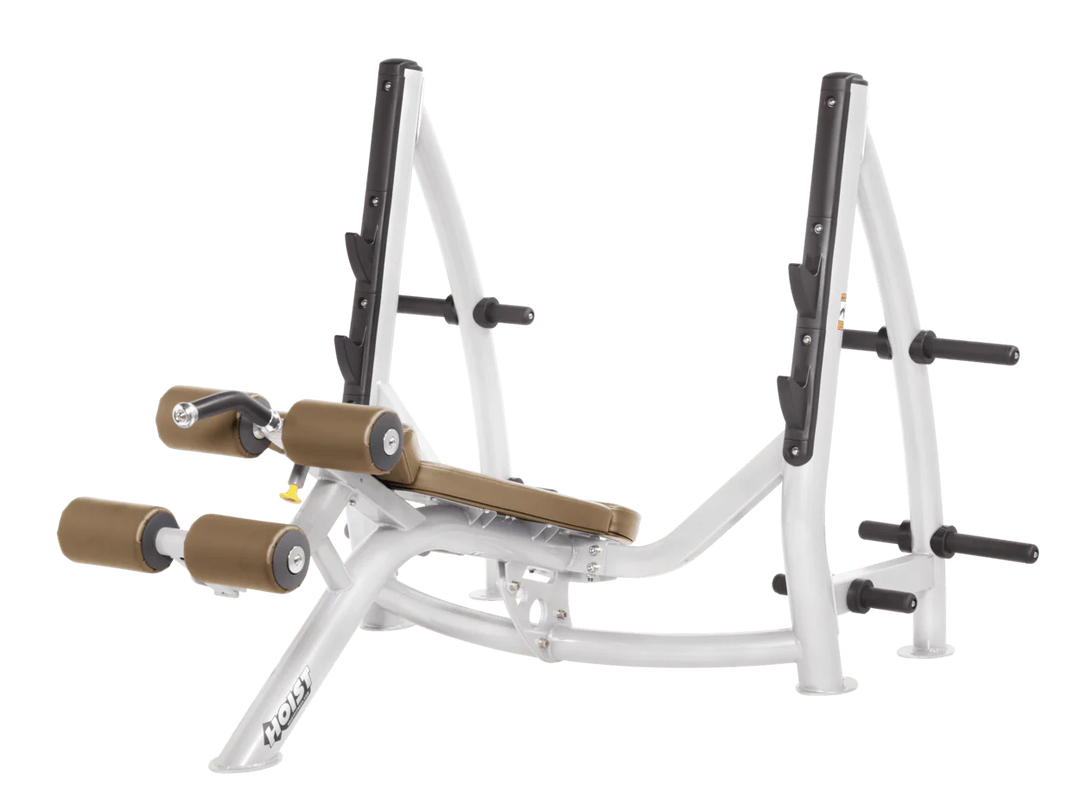 Hoist commercial Olympic decline white wheat bench with barbell rack and integrated weight plate storage for lower chest training