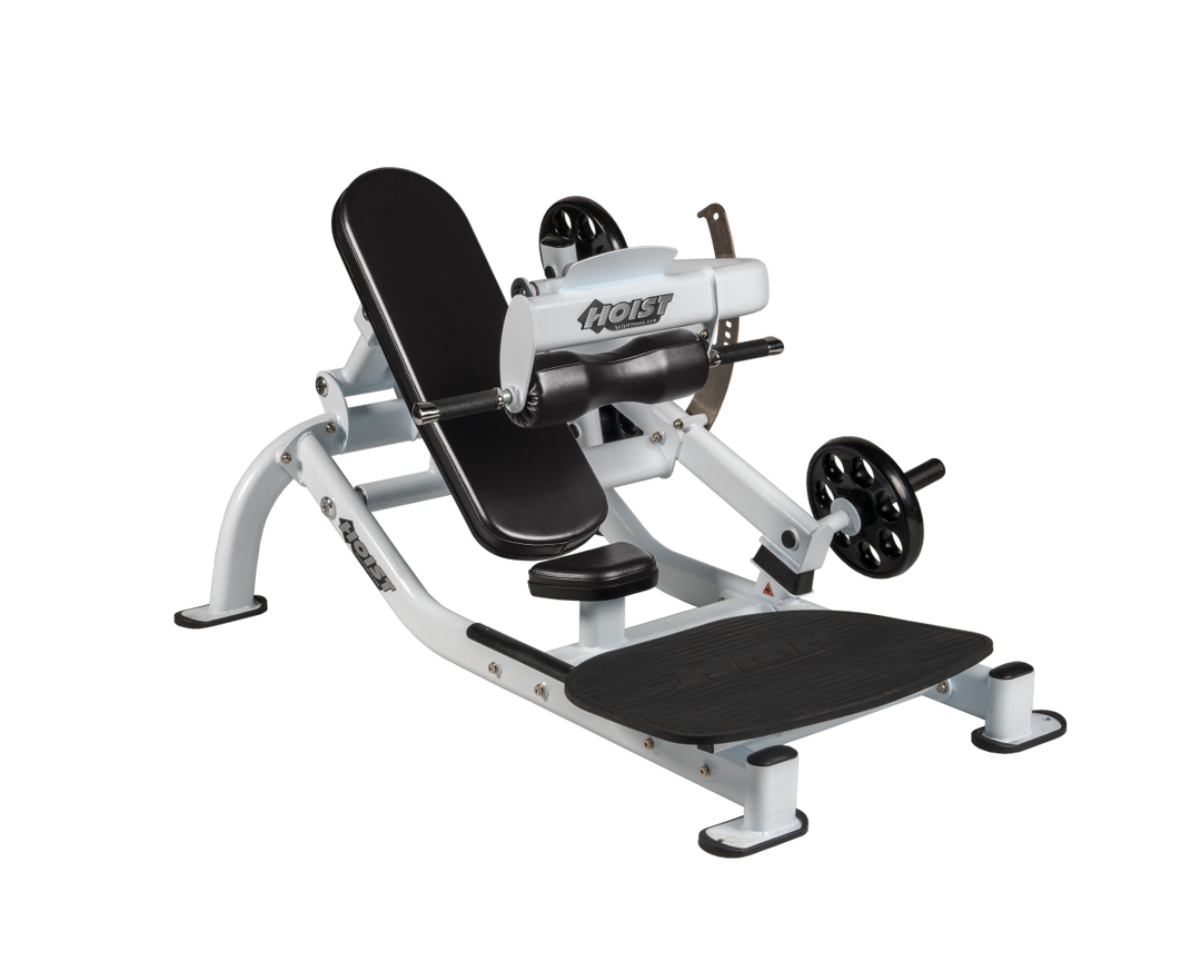 Angled view of BLK White glute thrust machine showing foot platform, seat, and weight plate loading positions
