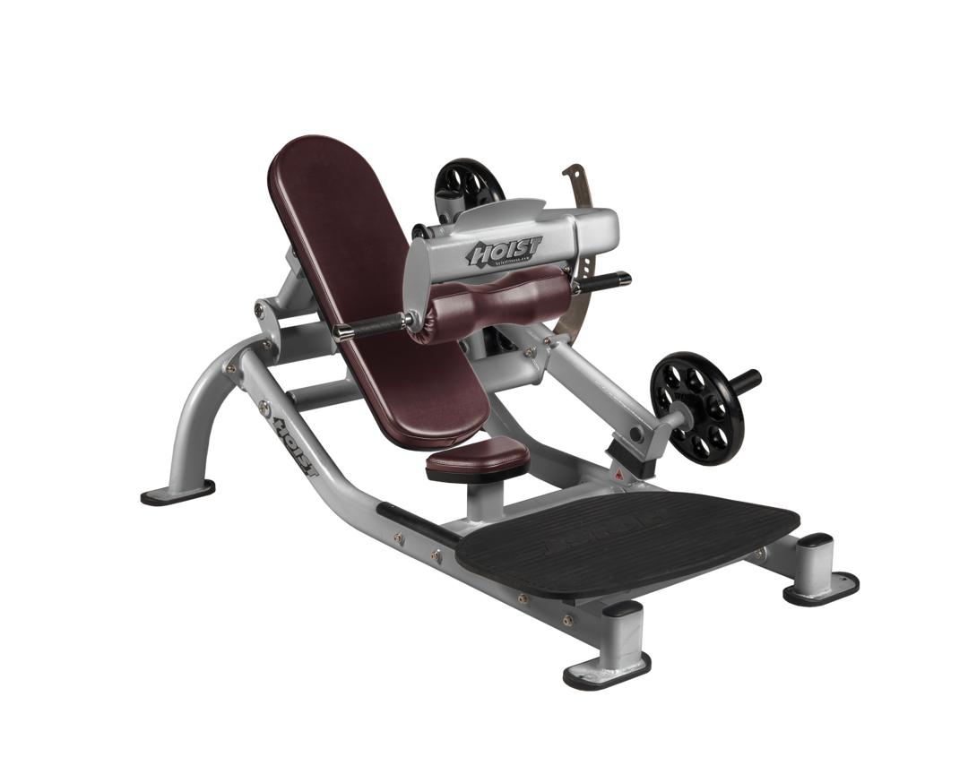 Angled view of BRG Platinum glute thrust machine showing foot platform, seat, and weight plate loading positions