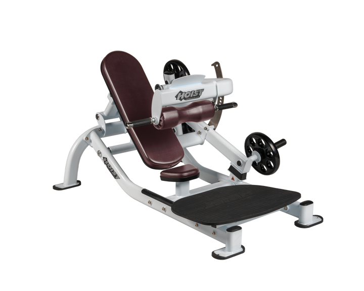 Angled view of BRG white glute thrust machine showing foot platform, seat, and weight plate loading positions