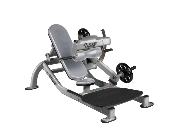 Angled view of DVG Platinum glute thrust machine showing foot platform, seat, and weight plate loading positions