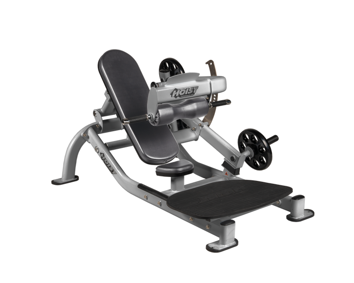 Angled view of SLG Platinum glute thrust machine showing foot platform, seat, and weight plate loading positions
