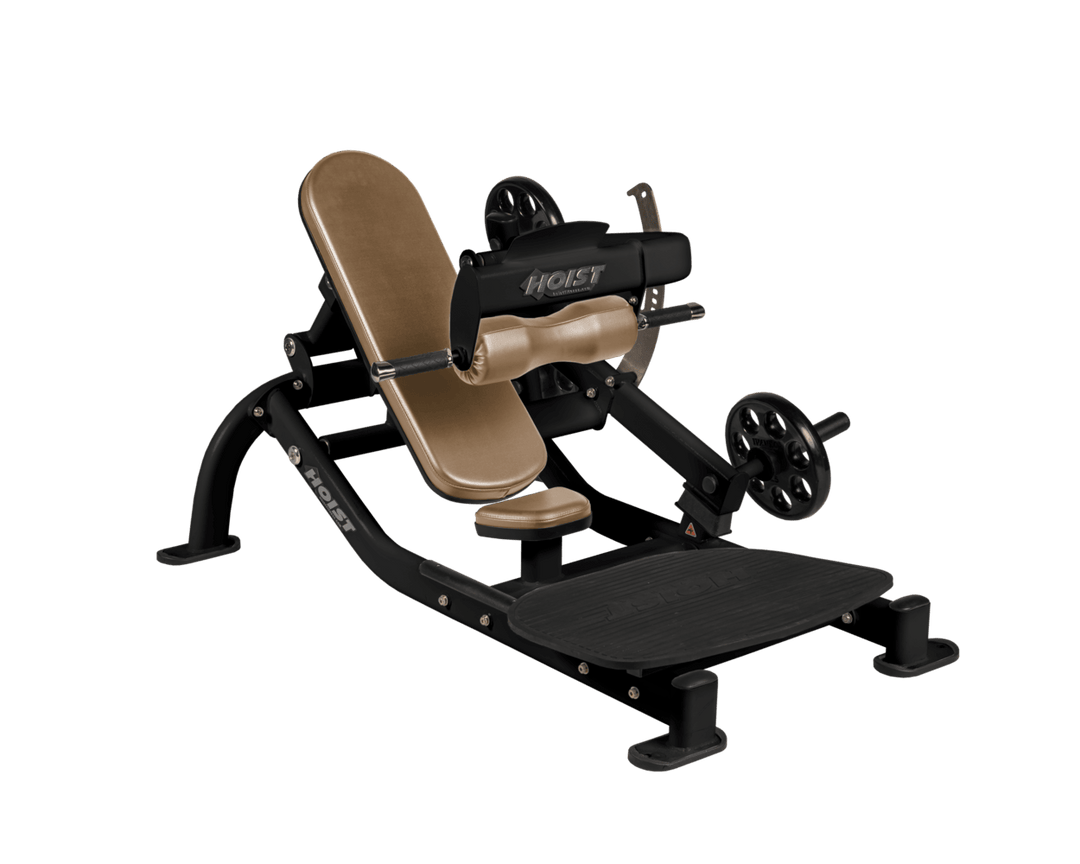 Angled view of WHT Matte Black glute thrust machine showing foot platform, seat, and weight plate loading positions