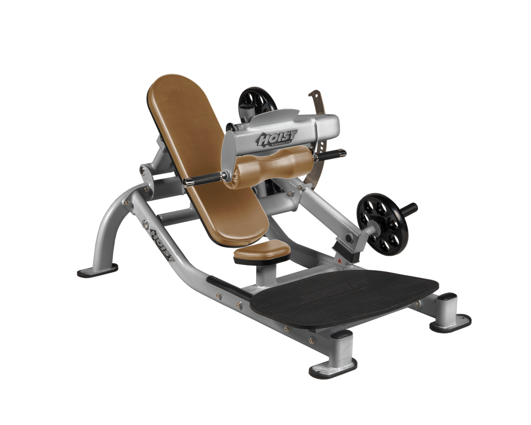 Angled view of WHT Platinum glute thrust machine showing foot platform, seat, and weight plate loading positions