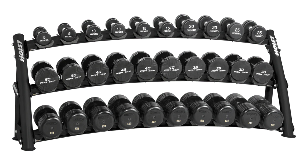 Three-tier matte black curved dumbbell rack fully loaded with dumbbells for high-capacity commercial storage