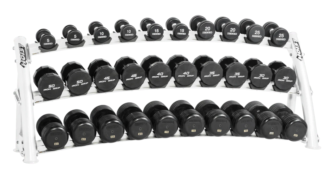 Three-tier white curved dumbbell rack fully loaded with dumbbells for high-capacity commercial storage