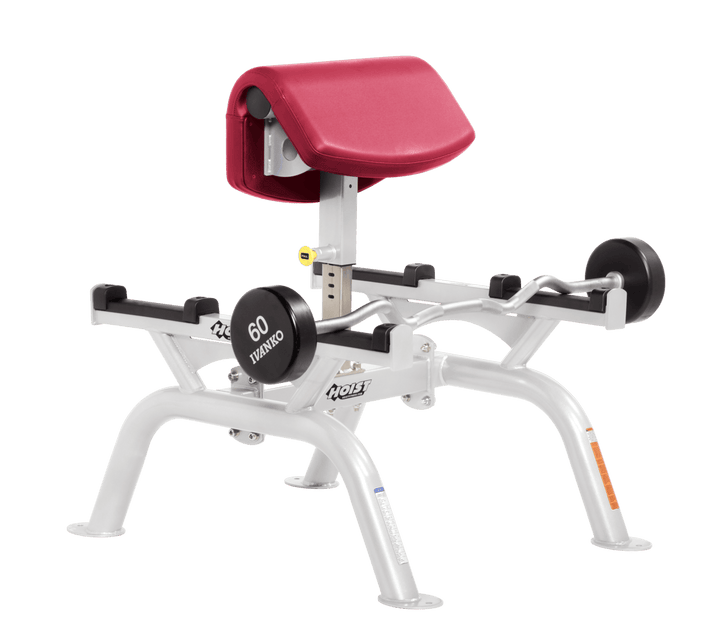 AMB Commercial standing preacher curl machine with white angled arm pad and plate-loaded bar for focused bicep training