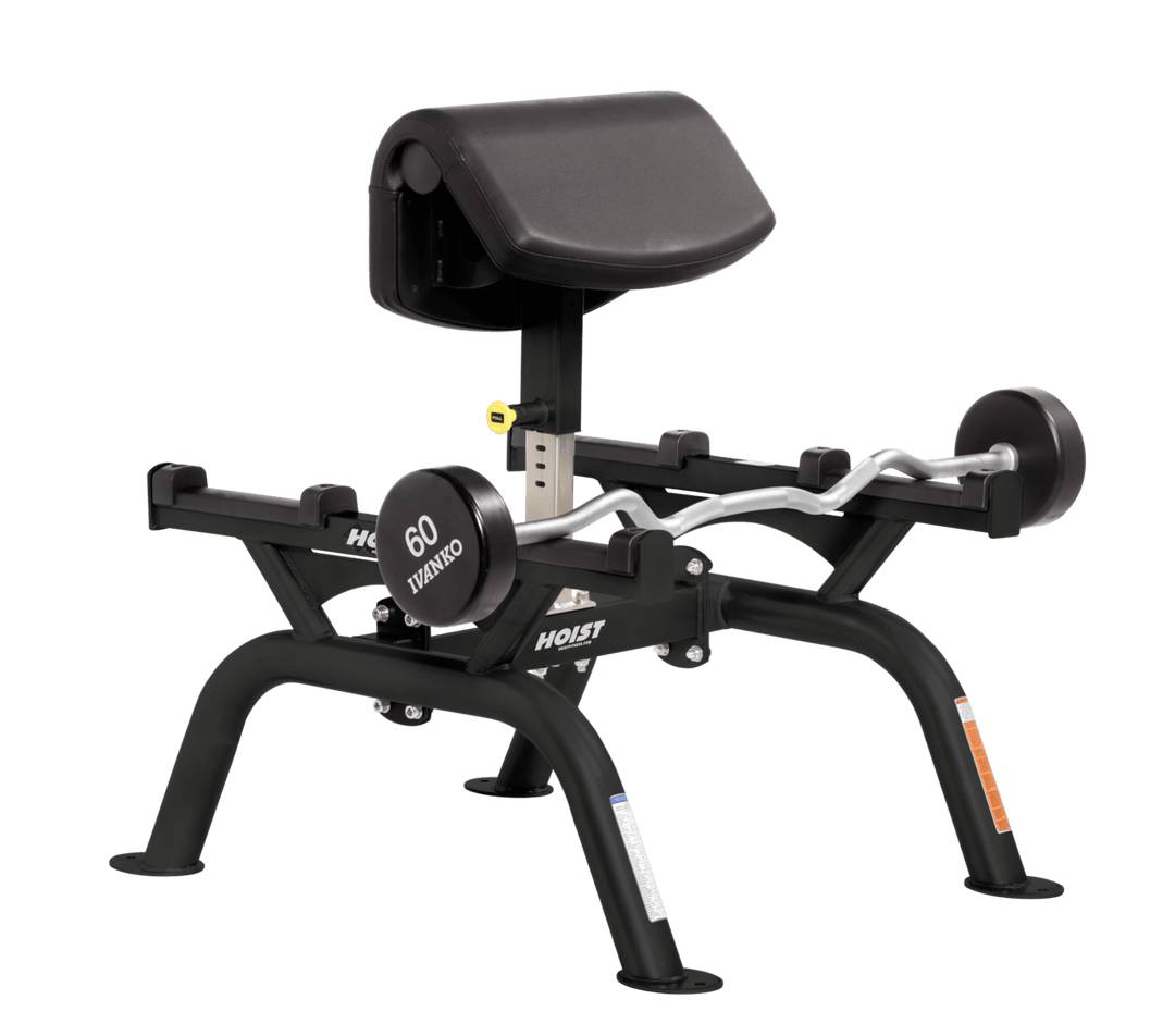 BLK Commercial standing preacher curl machine with angled arm pad and plate-loaded bar for focused bicep training