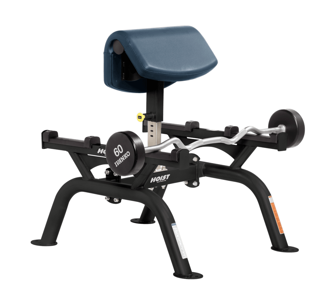 NVY Commercial standing preacher curl machine with angled arm pad and plate-loaded bar for focused bicep training