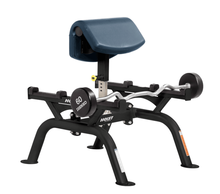 NVY Commercial standing preacher curl machine with angled arm pad and plate-loaded bar for focused bicep training