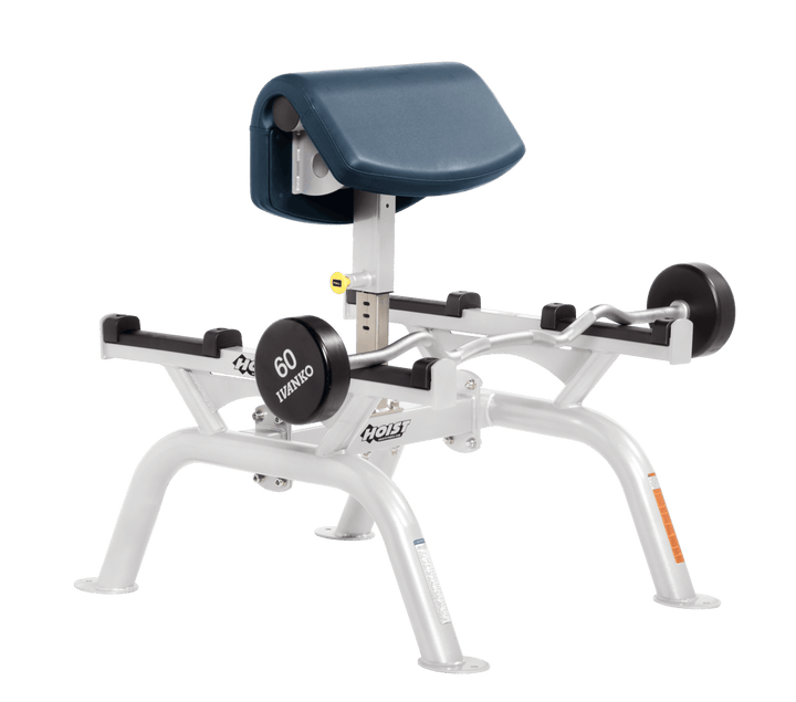 NVY Commercial standing preacher curl machine with white angled arm pad and plate-loaded bar for focused bicep training