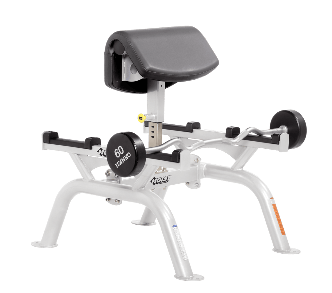 SLG Commercial standing preacher curl machine with white angled arm pad and plate-loaded bar for focused bicep training