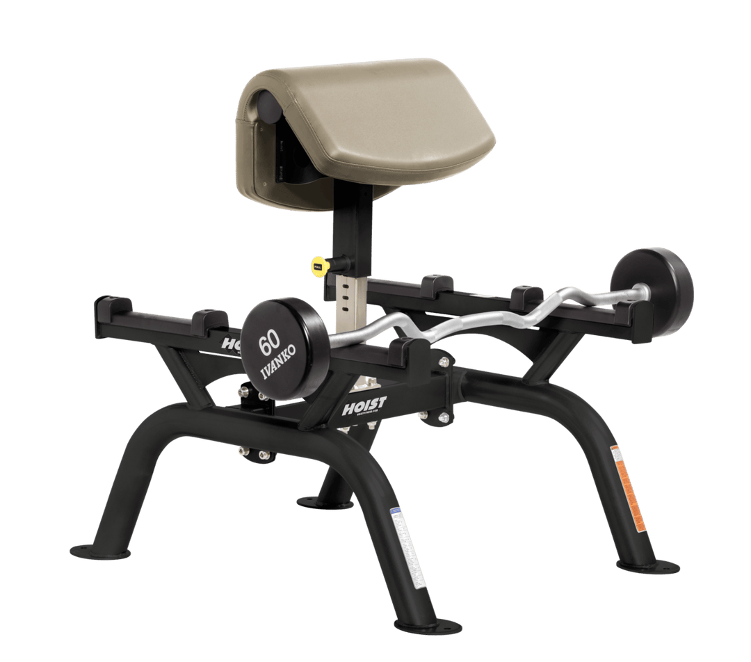 SUE Commercial standing preacher curl machine with angled arm pad and plate-loaded bar for focused bicep training