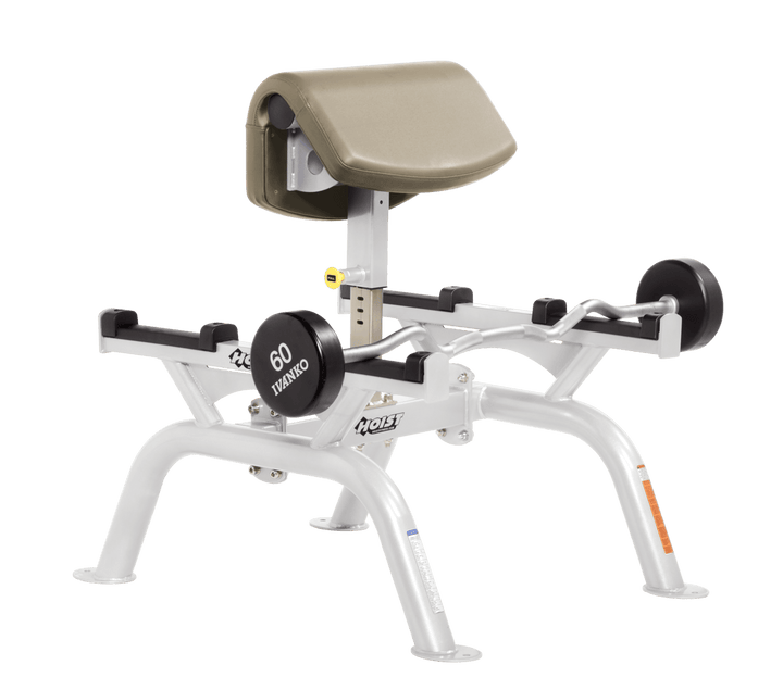 SUE Commercial standing preacher curl machine with white angled arm pad and plate-loaded bar for focused bicep training
