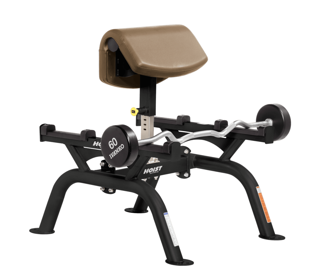 WHT Commercial standing preacher curl machine with angled arm pad and plate-loaded bar for focused bicep training