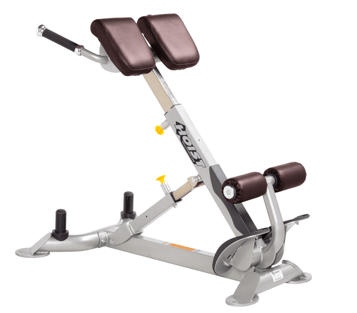 Commercial BRG platinum back hyperextension bench with angled pads and foot supports for lower back and core training