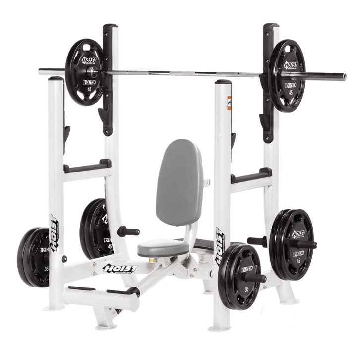 Commercial DVG white military press machine with seated back support and plate-loaded arms for shoulder strength training