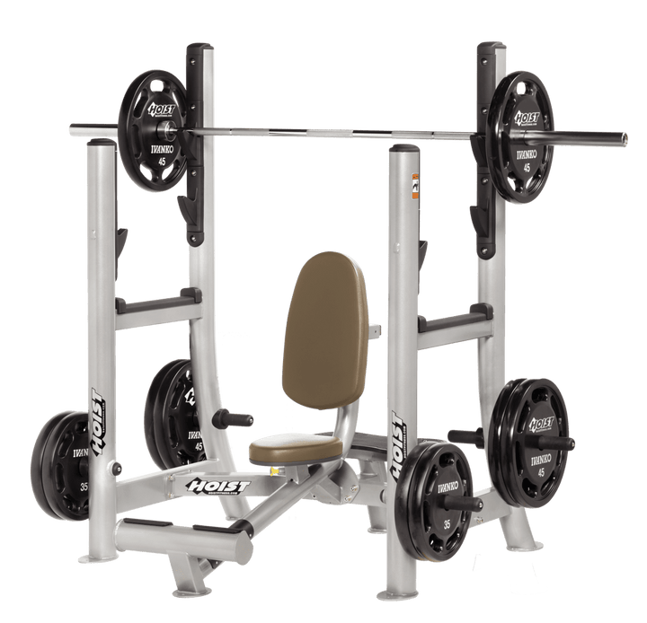Commercial WHT Platinum military press machine with seated back support and plate-loaded arms for shoulder strength training