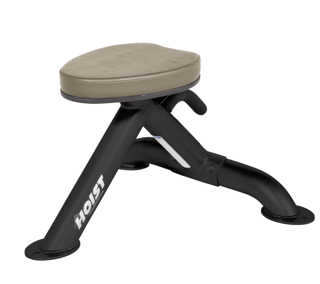Commercial suede utility stool with padded seat and compact frame for versatile strength training support