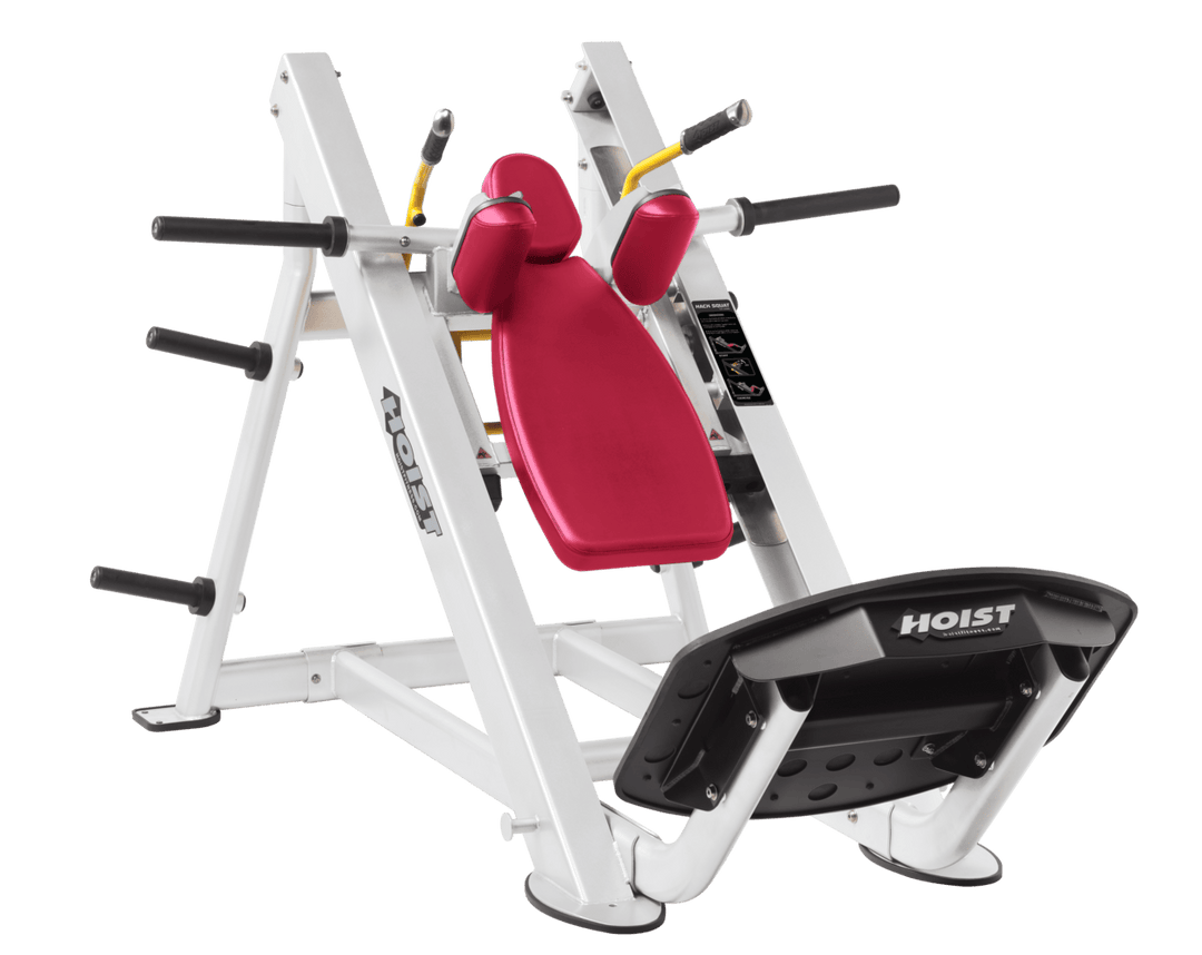 AMB White Commercial hack squat machine with angled backrest, shoulder pads, and footplate for lower body strength training