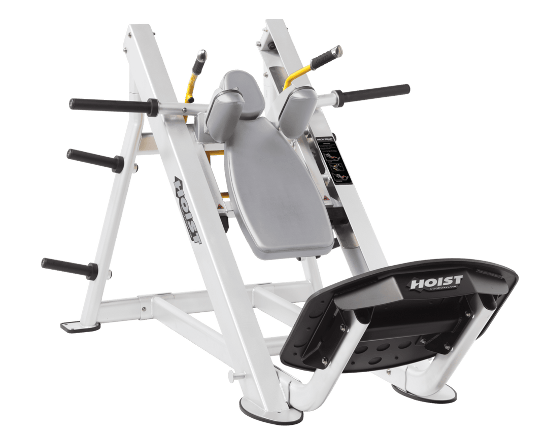 DVG White Commercial hack squat machine with angled backrest, shoulder pads, and footplate for lower body strength training