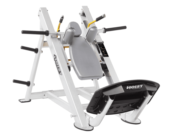 DVG White Commercial hack squat machine with angled backrest, shoulder pads, and footplate for lower body strength training