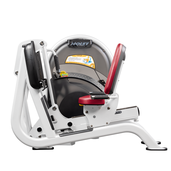 White Seated leg press machine with angled foot platform and back support for lower body strength training