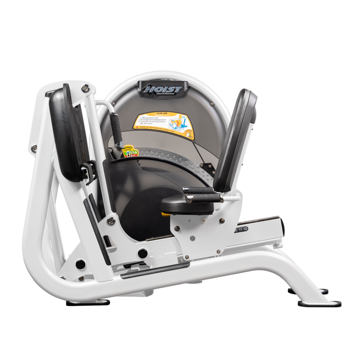 White Seated leg press machine with angled foot platform and back support for lower body strength training