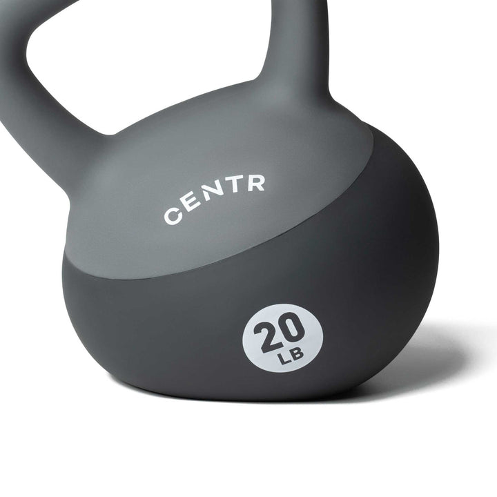 Close-up of Centr 20 lb soft round kettlebell showing the molded body and weight marking