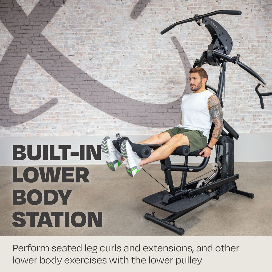 Centr body weight home gym in use at the built-in seated leg curl and extension station