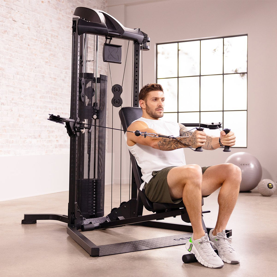 Centr folding workout bench used with a functional trainer for a seated cable exercise