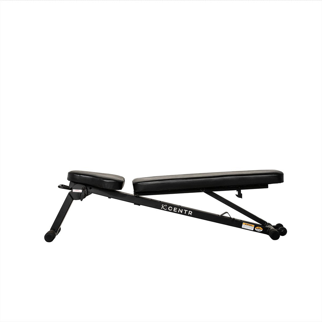 Centr folding workout bench set to a low incline position with adjustable padded backrest