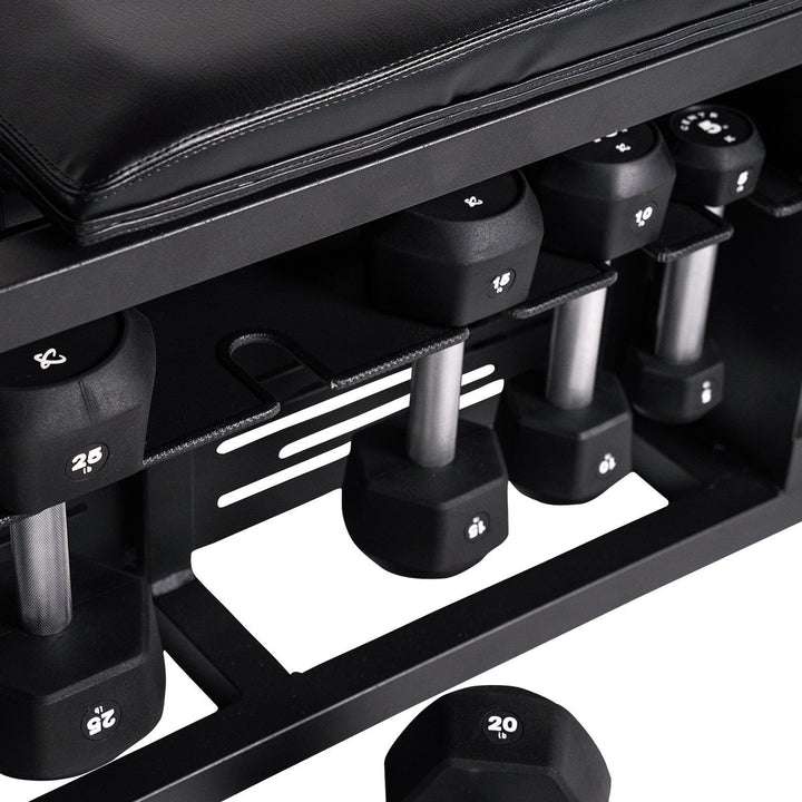 Close-up of integrated dumbbell storage beneath the Centr Fusion adjustable workout bench