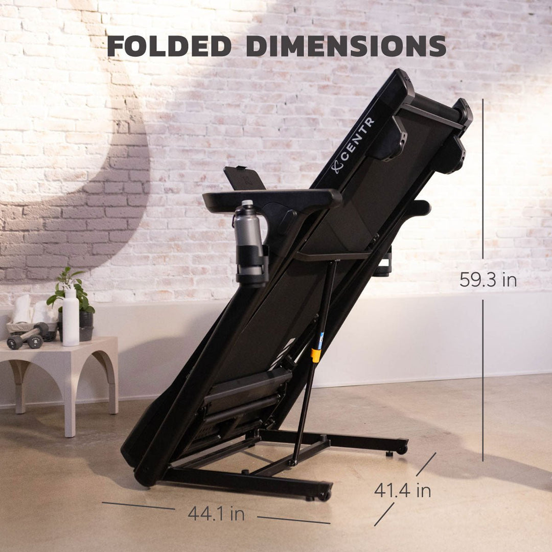 Centr Runr folding treadmill in its folded position with folded dimensions displayed