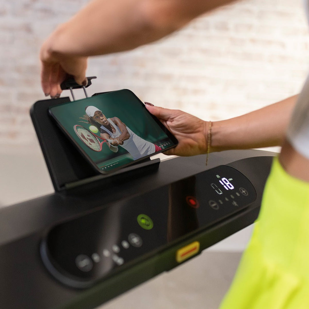 Centr Runr treadmill console with tablet positioned in the integrated tablet holder