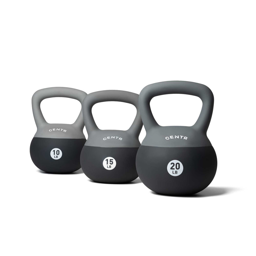 Three Centr soft round kettlebells in 10, 15, and 20 lb sizes arranged together