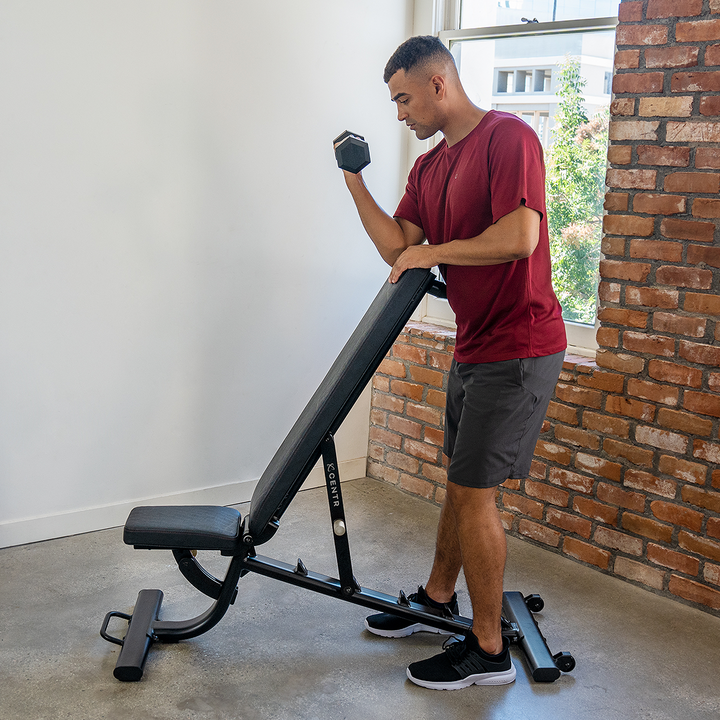 Centr adjustable workout bench being set to an incline back-pad position for strength training