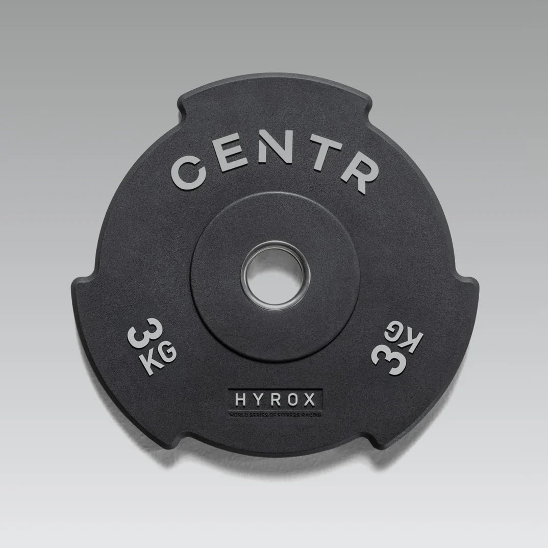 Angled view of the Centr x HYROX Edge Bumper Plate with interlocking edge design.