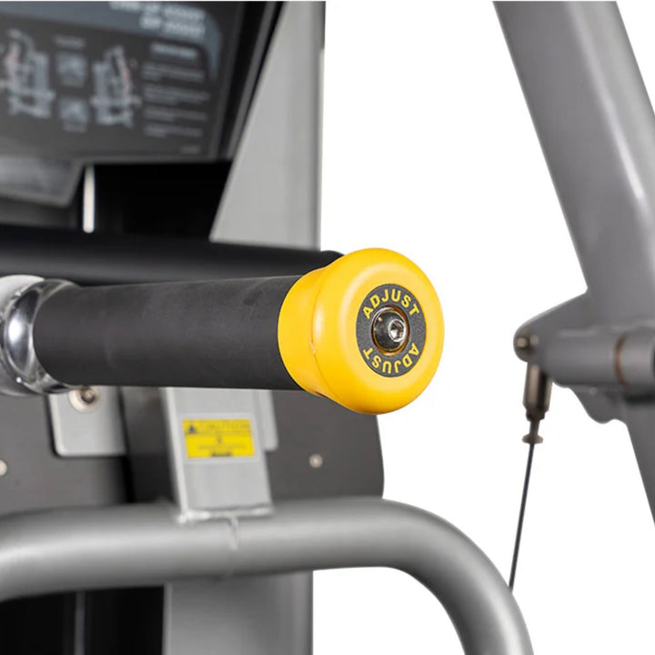 close up of chin dip assist machine handles and knee pad for support during exercise